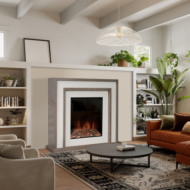 A living room with a large Evonic Murano fireplace in neutral and white colours. There is a black round coffee table on a floral rug in front of the fire and two leather sofas in cream and brown. There are bookshelves filled with books on either side of the fire and a large plant. 